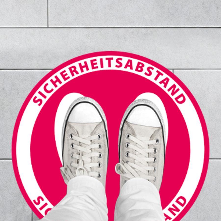Fußbodenaufkleber mit der Aufschrift Sicherheitsabstand